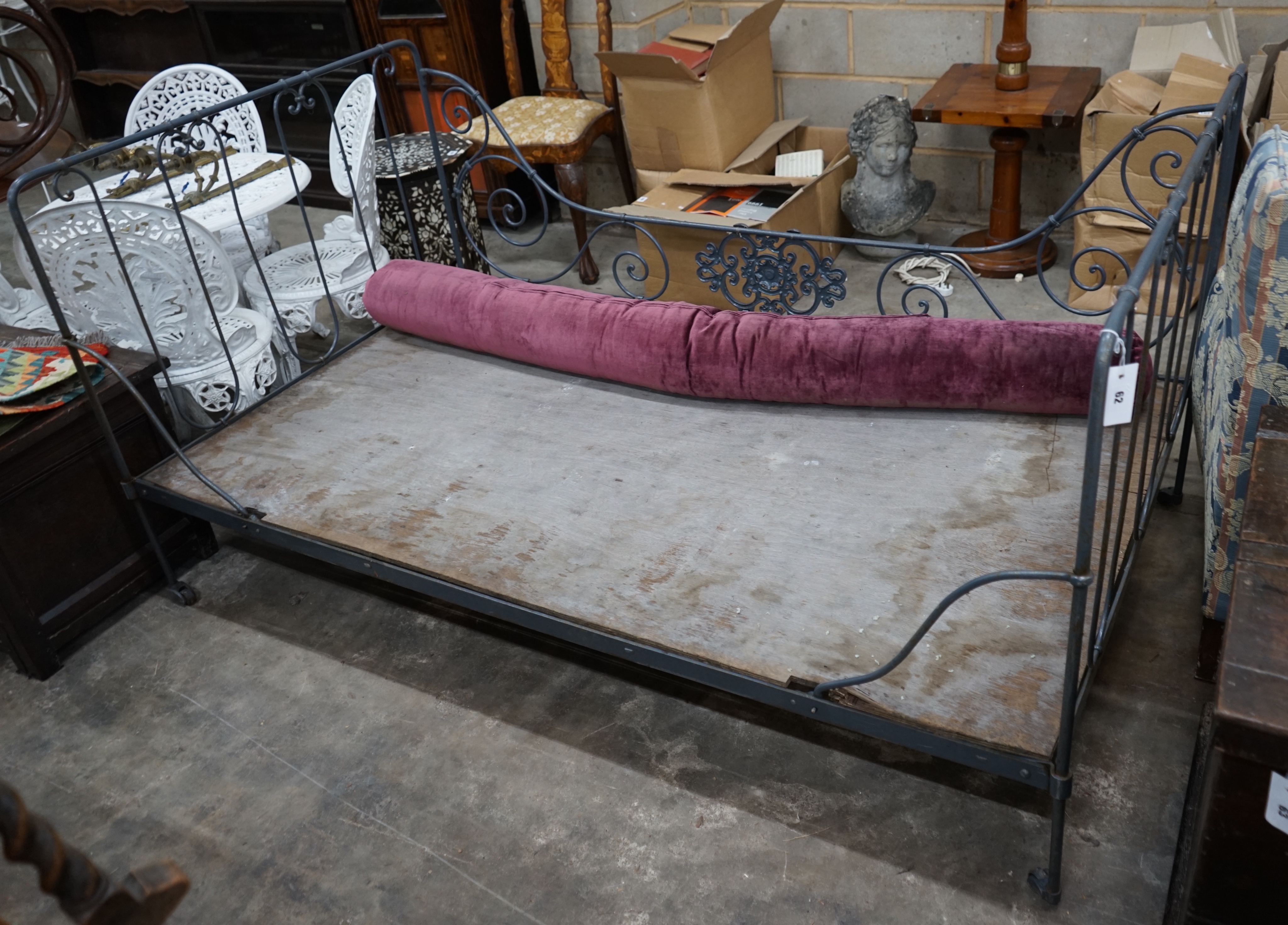 A late Victorian wrought iron bed frame, length 188cm depth 110cm height 96cm